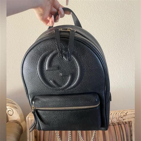 black gucci backpack with gold chain